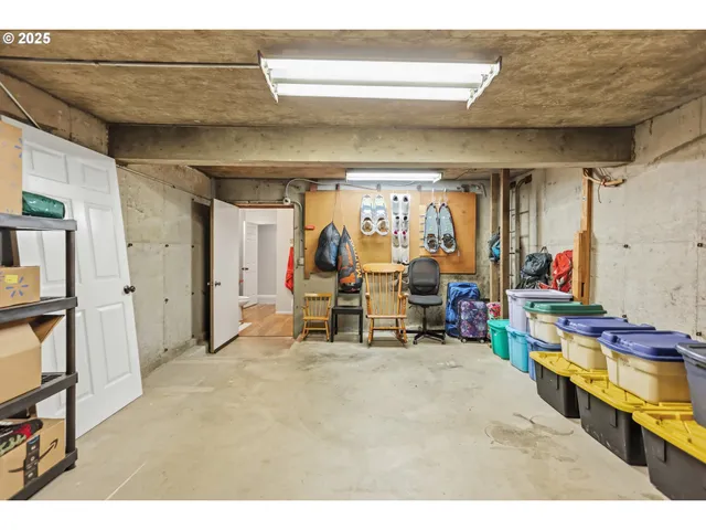 a bed room with a bed and a painting