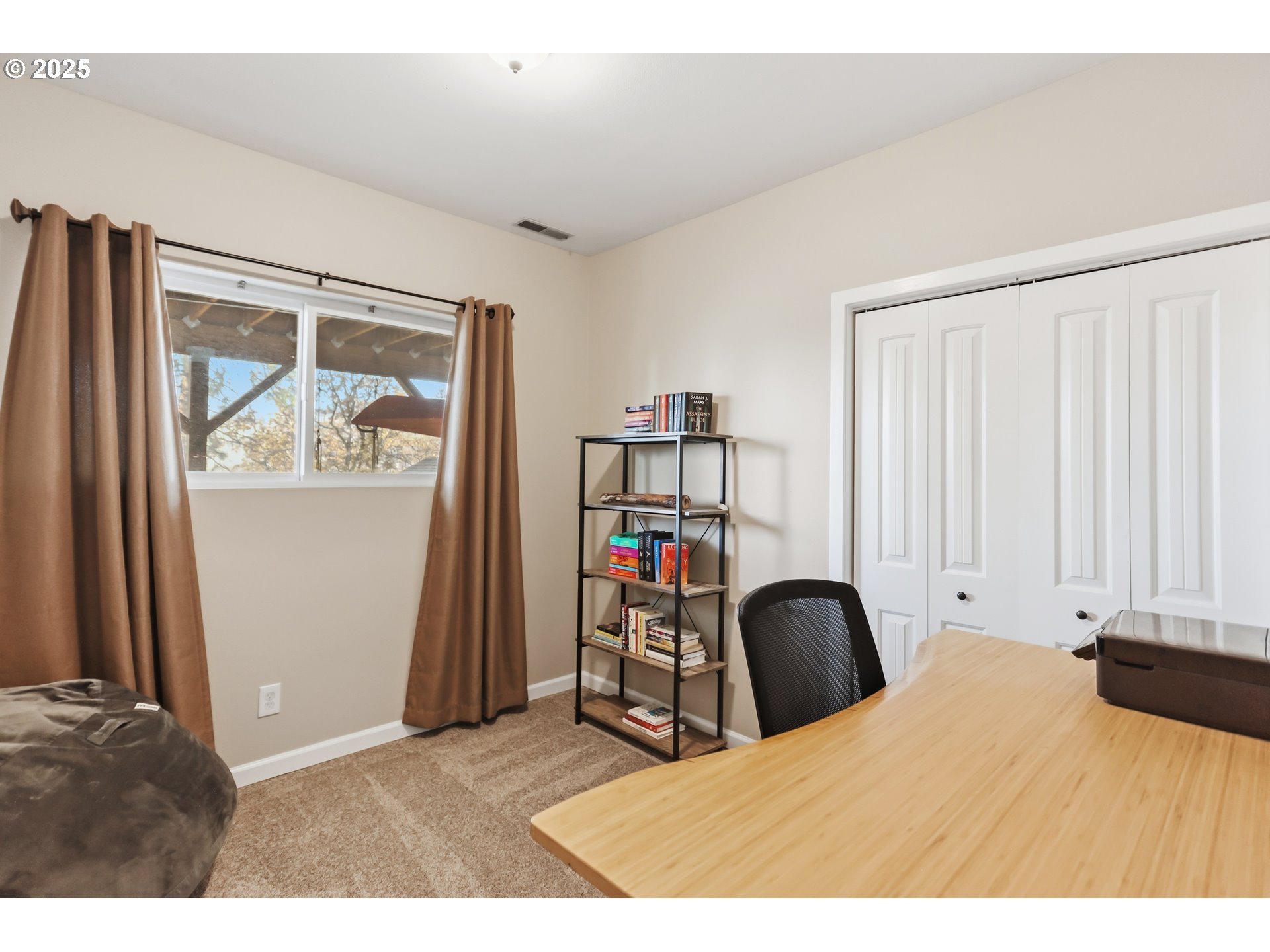 522 West 22nd Street The Dalles, OR 97058 - Photo 15 of 26 a bed room with a bed and a painting