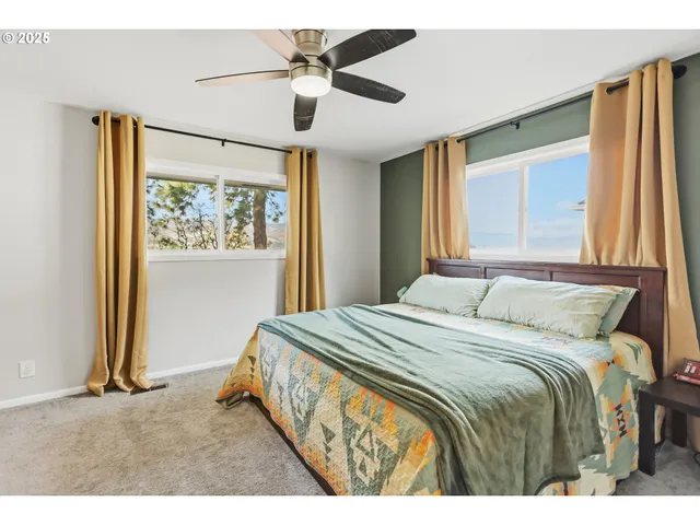 a bedroom with furniture and a book shelf