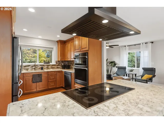 a kitchen with a sink stove and refrigerator