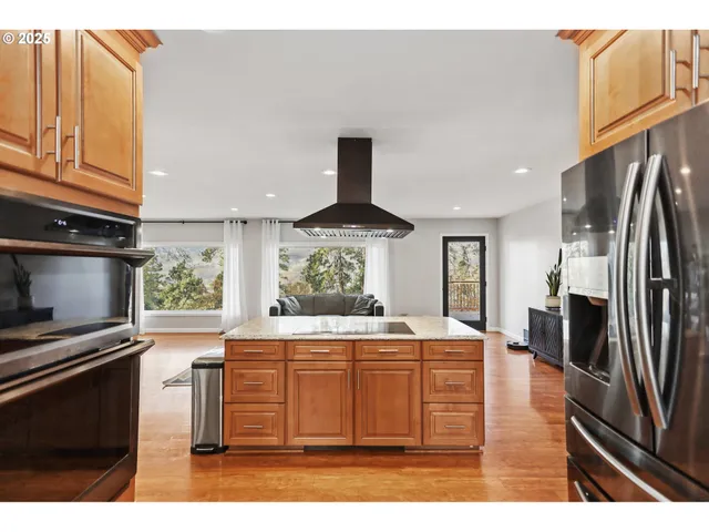 a living room with lots of furniture and a dining table