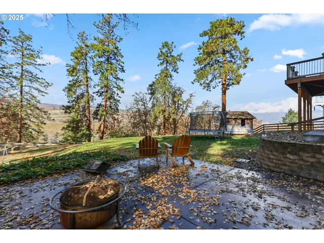 a view of a house with a yard porch and sitting area