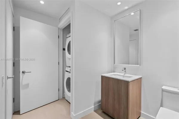 a bathroom with a double vanity sink a and mirror