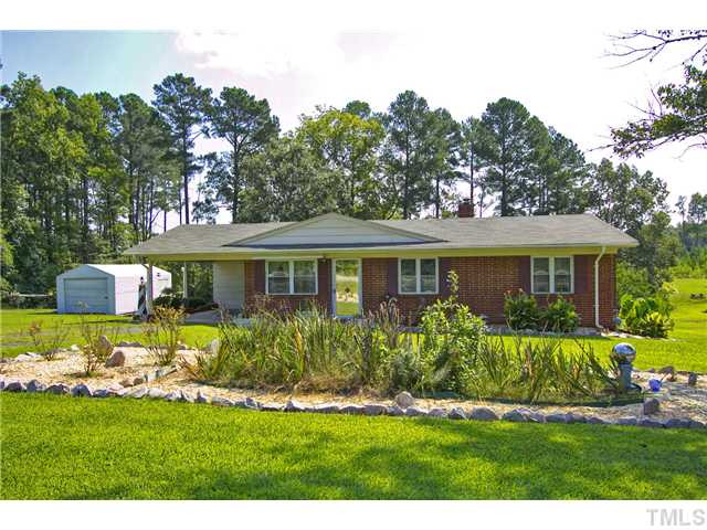 222 Santee Road Durham, NC 27704 - Photo 1 of 21 a front view of a house with a garden
