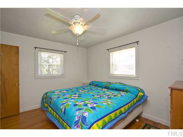 222 Santee Road Durham, NC 27704 - Photo 8 of 21 a bedroom that has a bed and a window