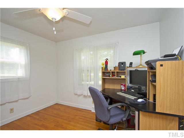 222 Santee Road Durham, NC 27704 - Photo 10 of 21 a workspace with furniture and wooden floor