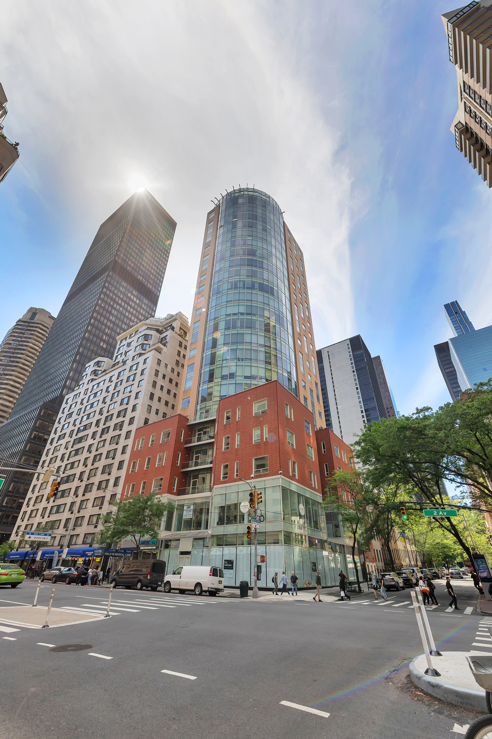 250 East 49th Street, Unit 3E Manhattan, NY 10017 - Photo 16 of 20 a view of a tall building next to a road