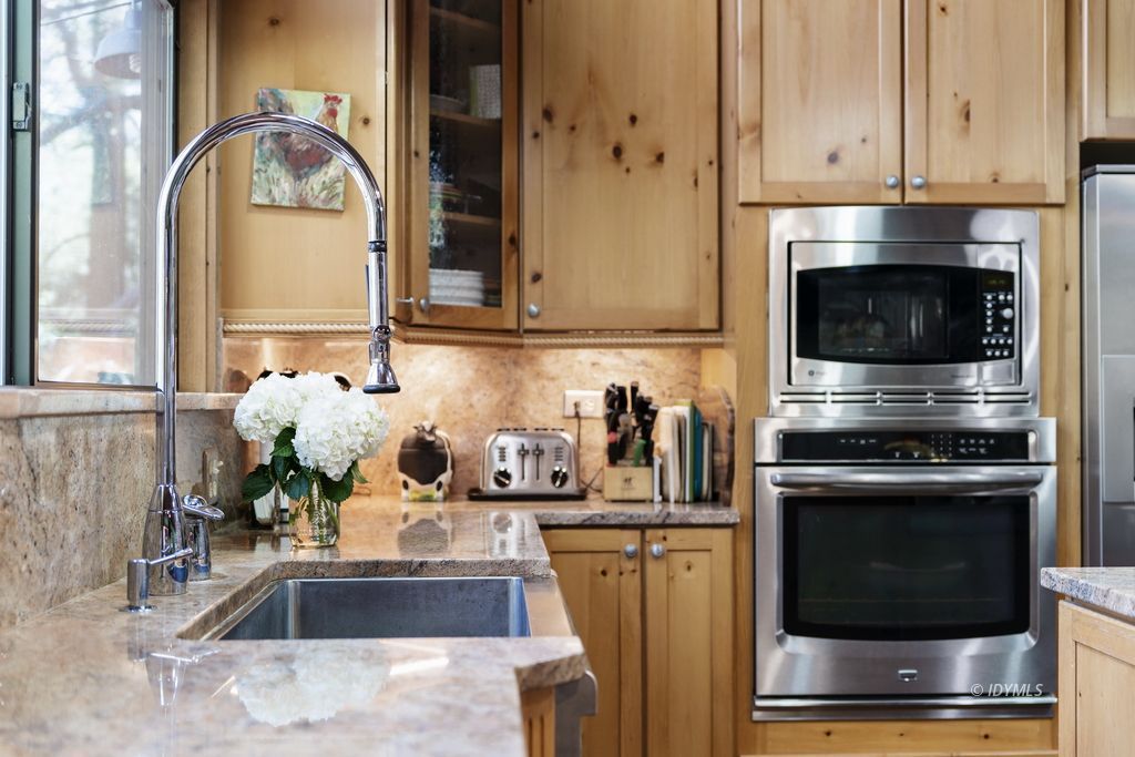 25575 Sunrise Drive Idyllwild, CA 92549 - Photo 13 of 35 a kitchen with granite countertop a sink stainless steel appliances and cabinets
