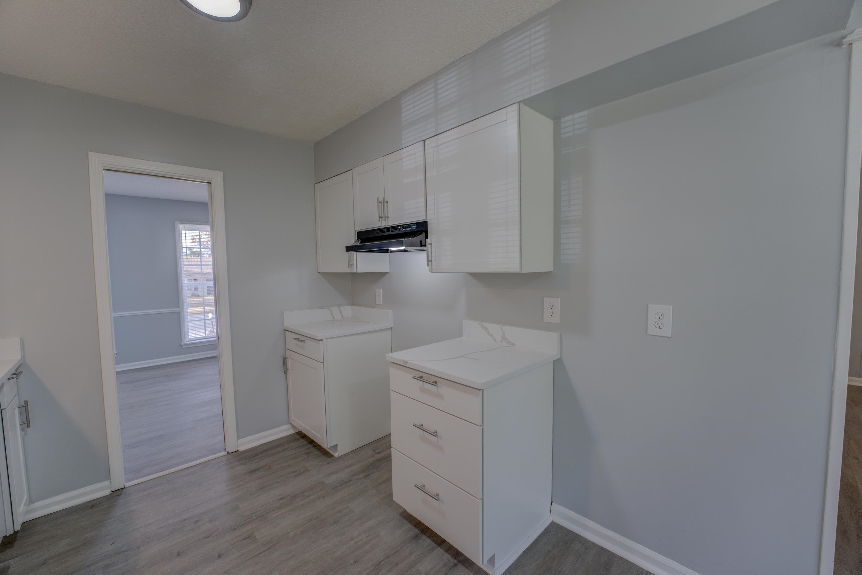3482 Clarke Road Memphis, TN 38115 - Photo 11 of 29 a kitchen with white cabinets and sink