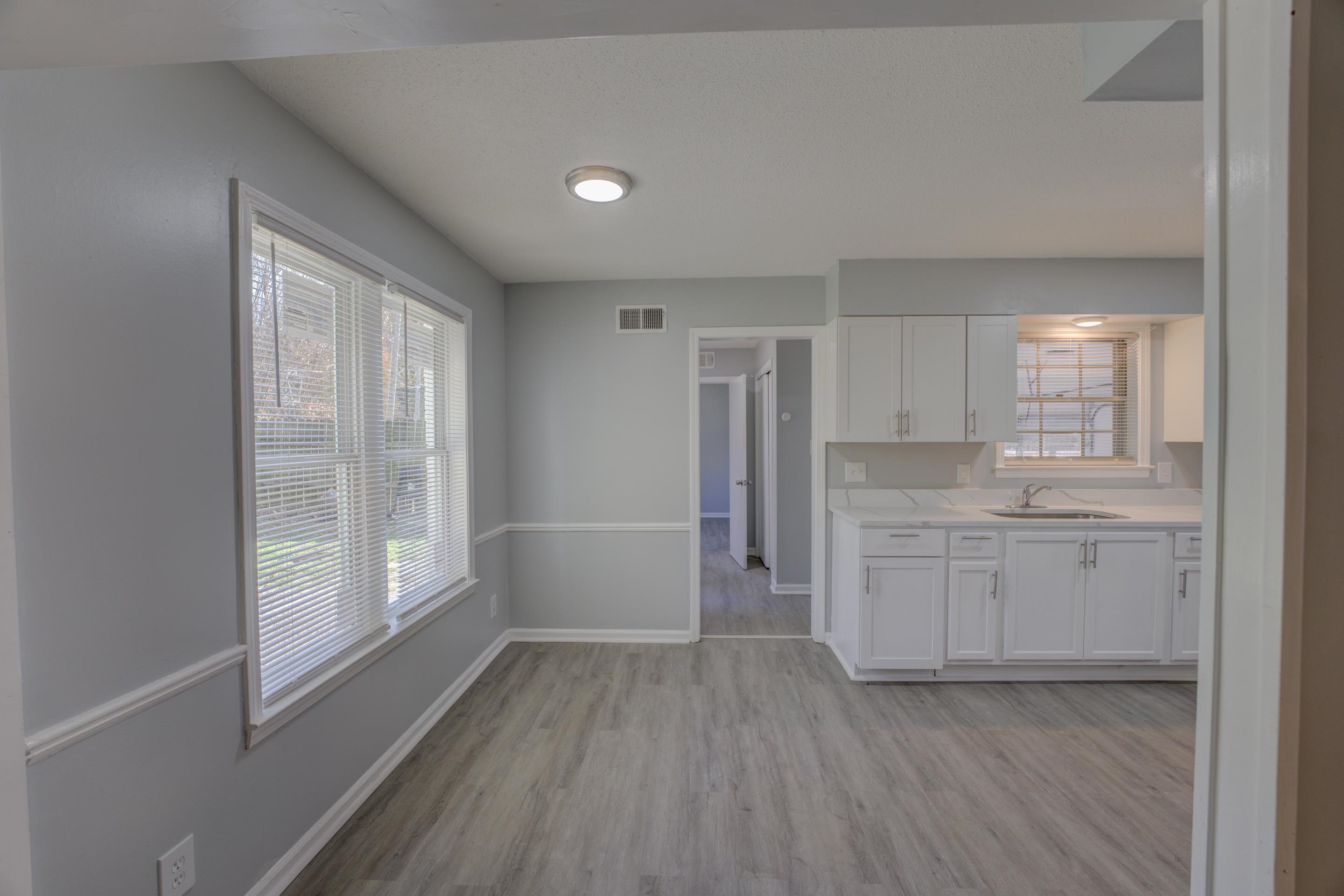 3482 Clarke Road Memphis, TN 38115 - Photo 14 of 29 a bathroom with a granite countertop sink mirror and a toilet
