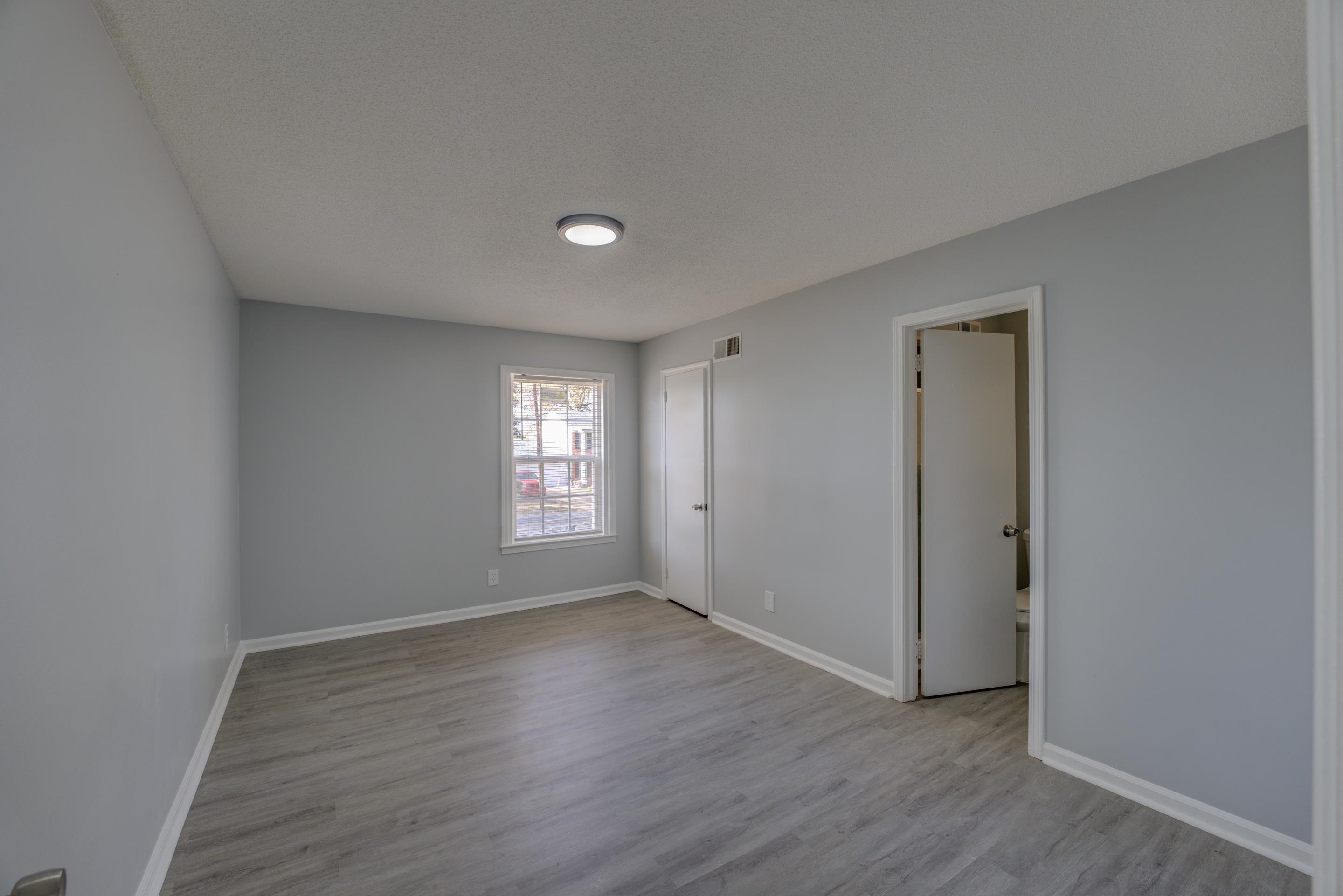 3482 Clarke Road Memphis, TN 38115 - Photo 16 of 29 a view of empty room with wooden floor and fan