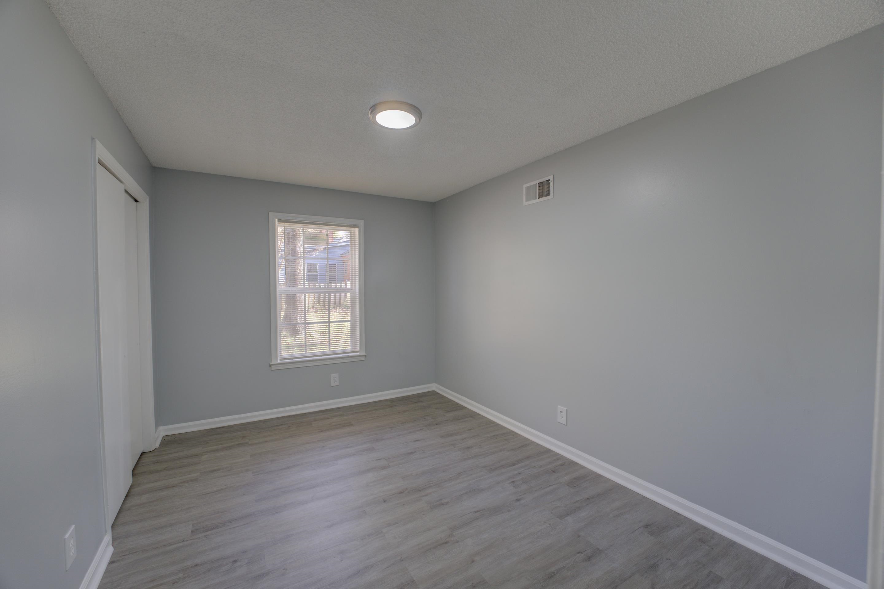 3482 Clarke Road Memphis, TN 38115 - Photo 19 of 29 a view of an empty room with wooden floor and window