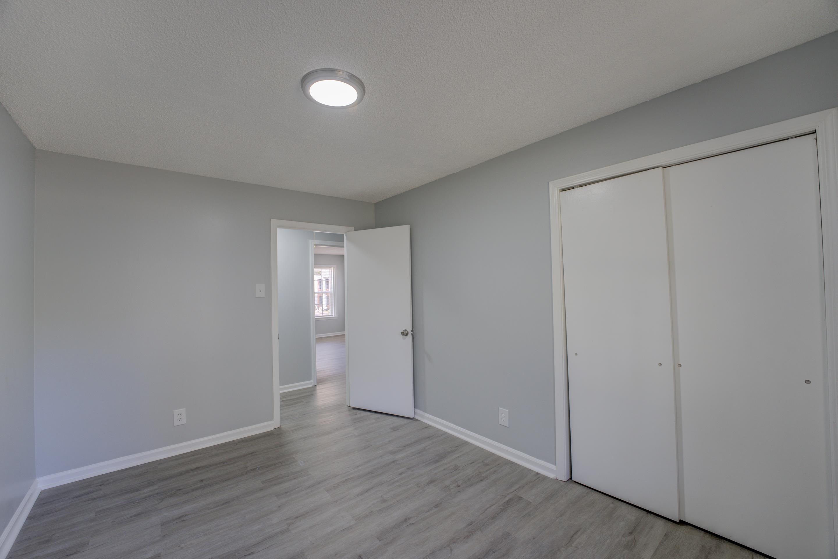3482 Clarke Road Memphis, TN 38115 - Photo 20 of 29 a view of an empty room with wooden floor