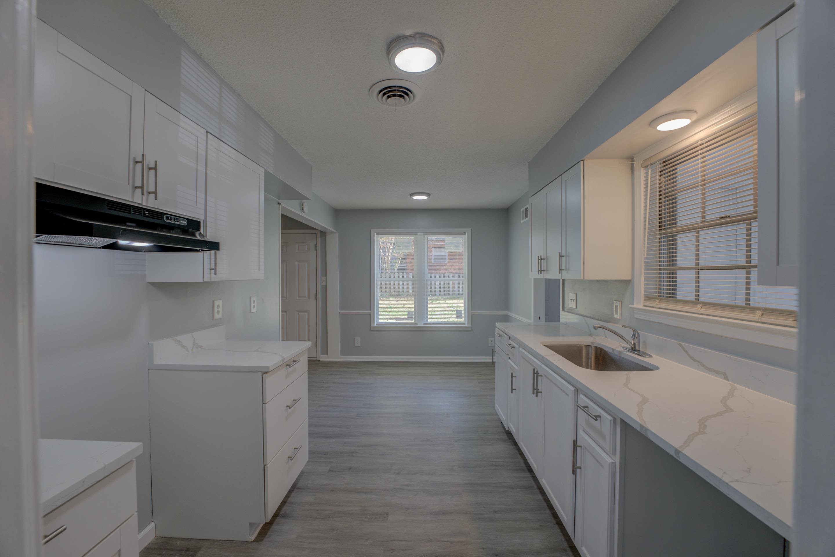 3482 Clarke Road Memphis, TN 38115 - Photo 10 of 29 a kitchen with a sink and cabinets