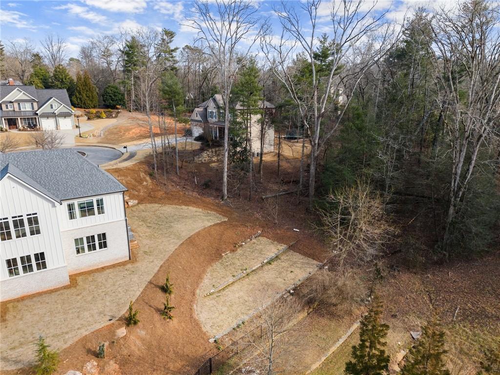 1064 Hartwell Crossing Gainesville, GA 30501 - Photo 2 of 14 a view of a white house in a yard