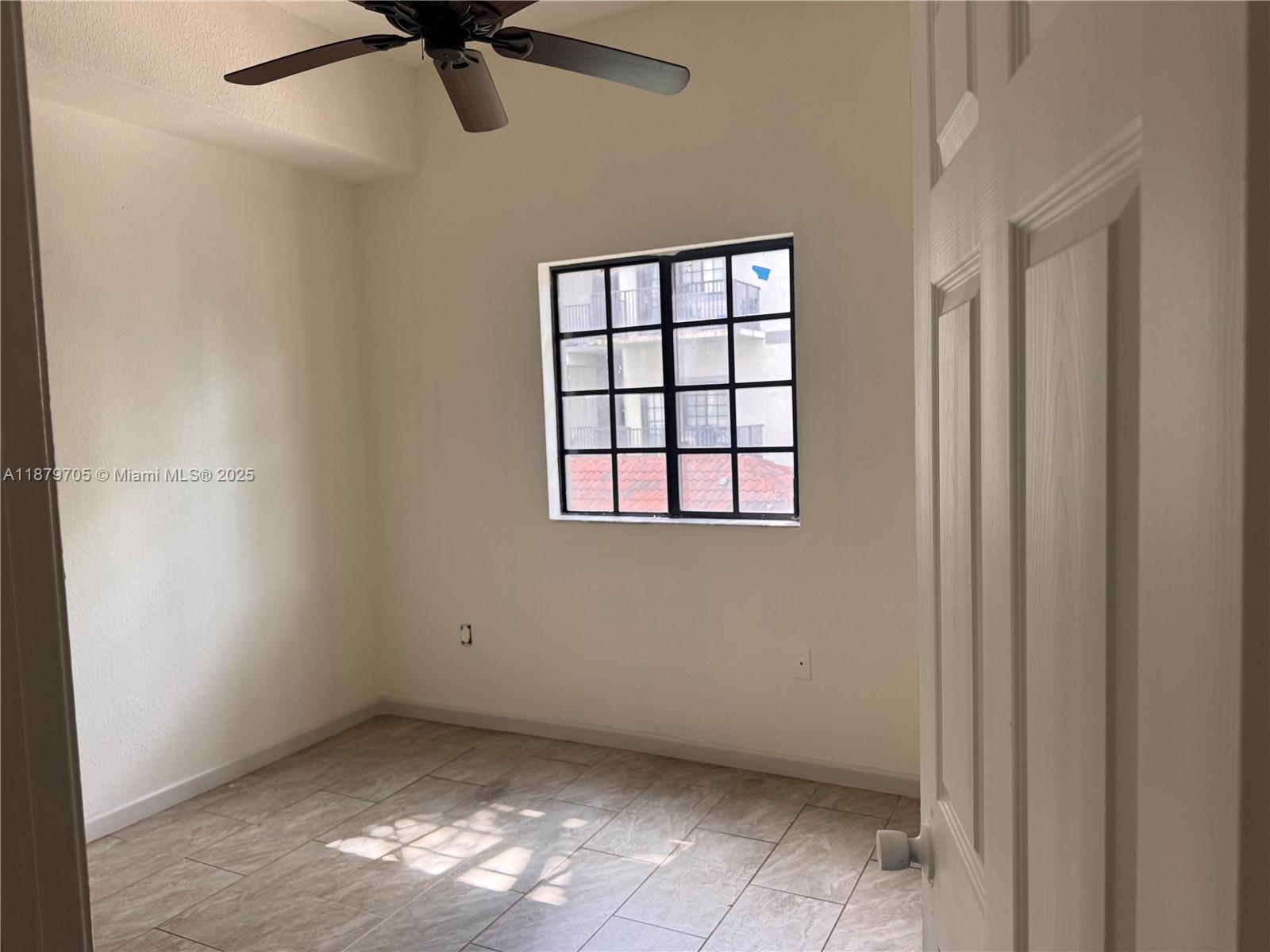 2851 Riverside Drive, Unit 203N Coral Springs, FL 33065 - Photo 2 of 5 a view of an empty room with a window