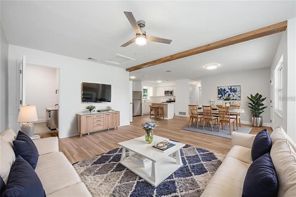 109 Magnolia Avenue Seffner, FL 33584 - Photo 2 of 46 a living room with furniture and a flat screen tv