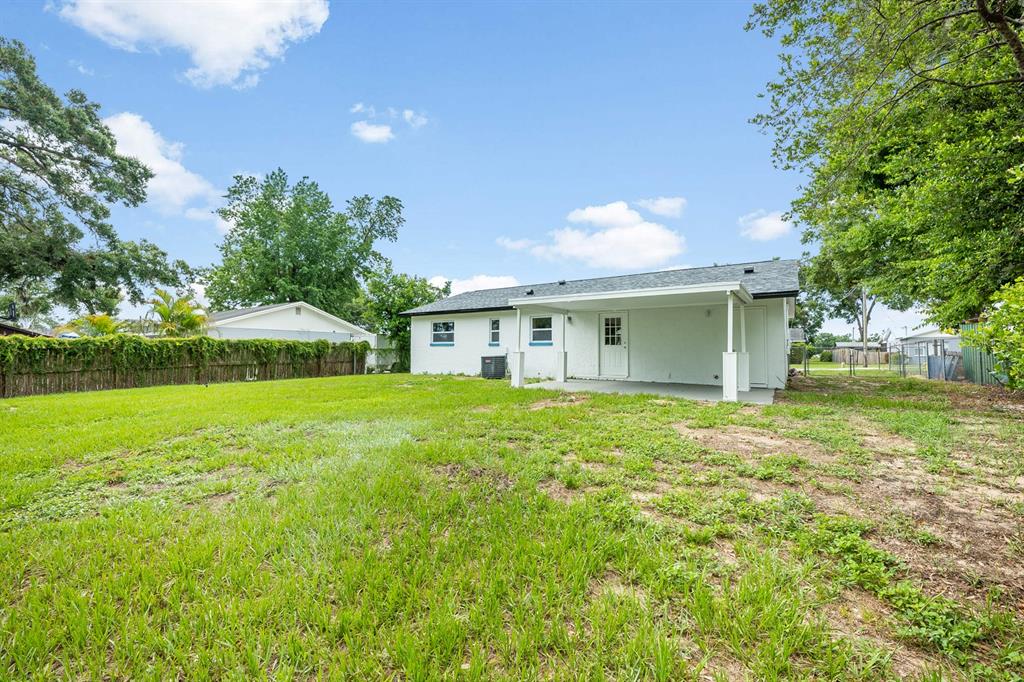 109 Magnolia Avenue Seffner, FL 33584 - Photo 28 of 46 a front view of a house with garden