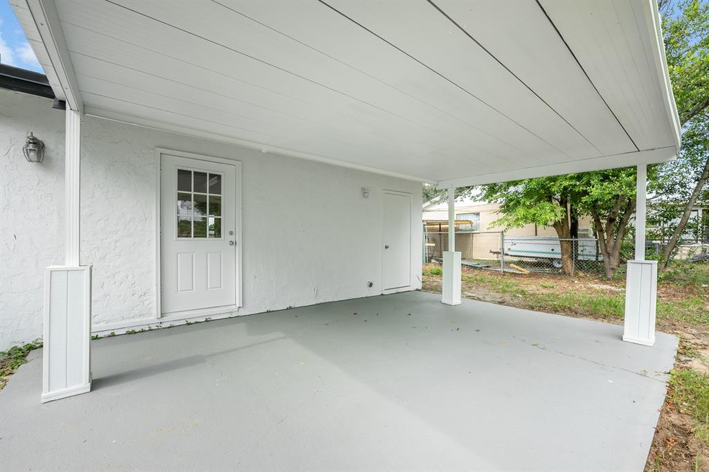 109 Magnolia Avenue Seffner, FL 33584 - Photo 29 of 46 a view of a room with porch and wooden floor