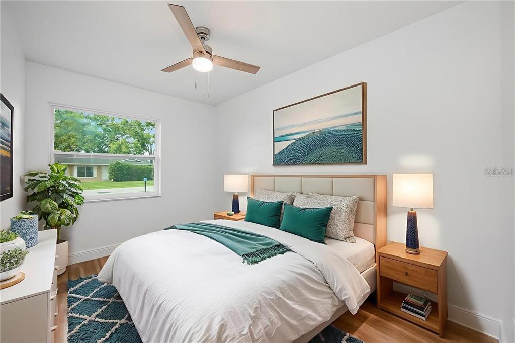 109 Magnolia Avenue Seffner, FL 33584 - Photo 4 of 46 a bedroom with a bed and a painting on the wall