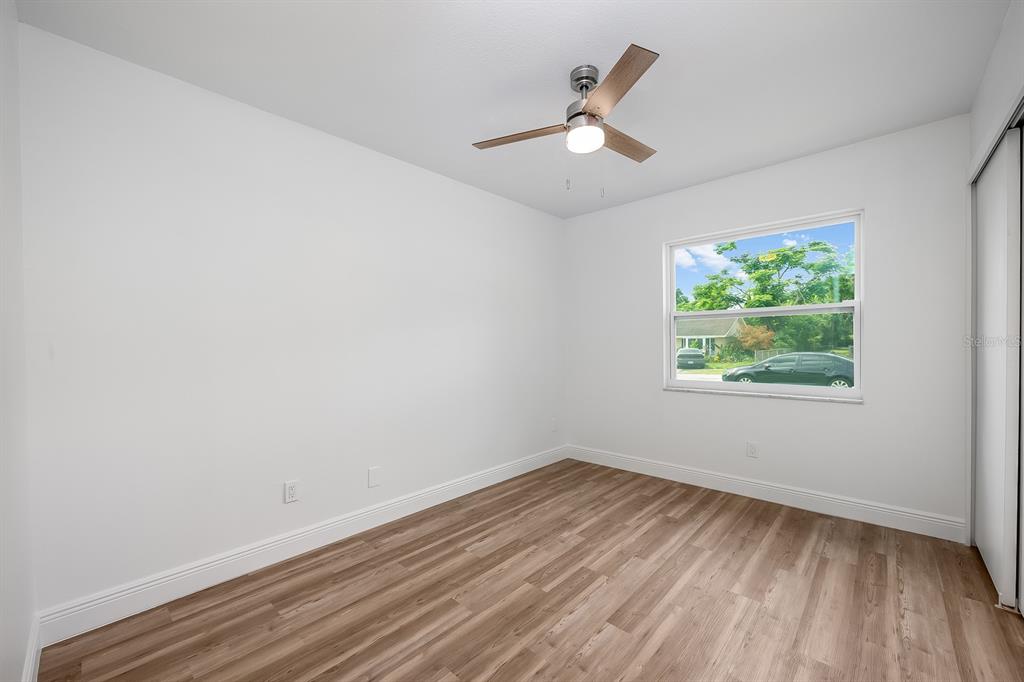 109 Magnolia Avenue Seffner, FL 33584 - Photo 43 of 46 wooden floor in an empty room with a window