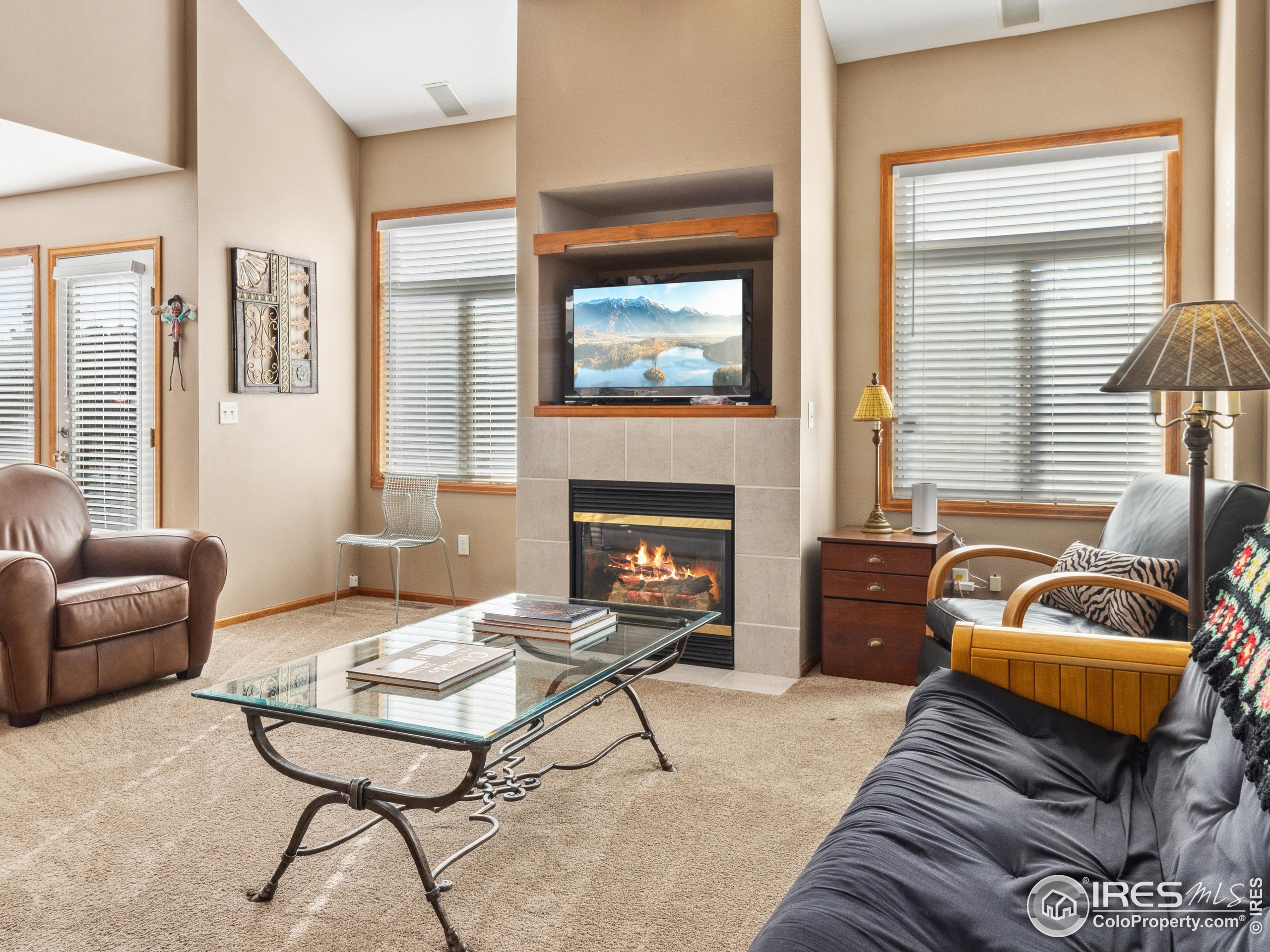 300 Far View Drive, Unit 7 Estes Park, CO 80517 - Photo 1 of 26 a living room with furniture and a fireplace