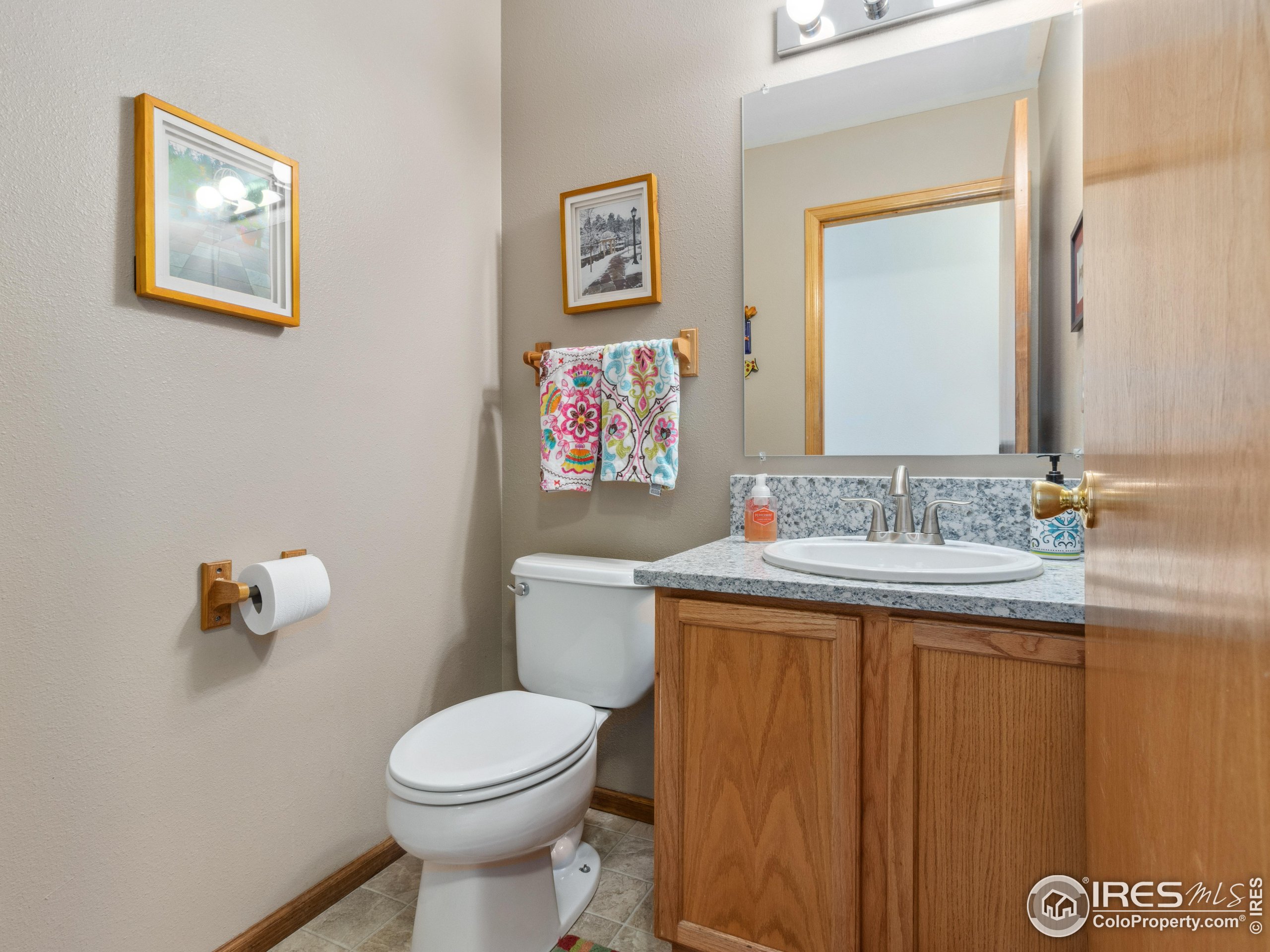 300 Far View Drive, Unit 7 Estes Park, CO 80517 - Photo 12 of 26 a bathroom with a toilet a sink and mirror