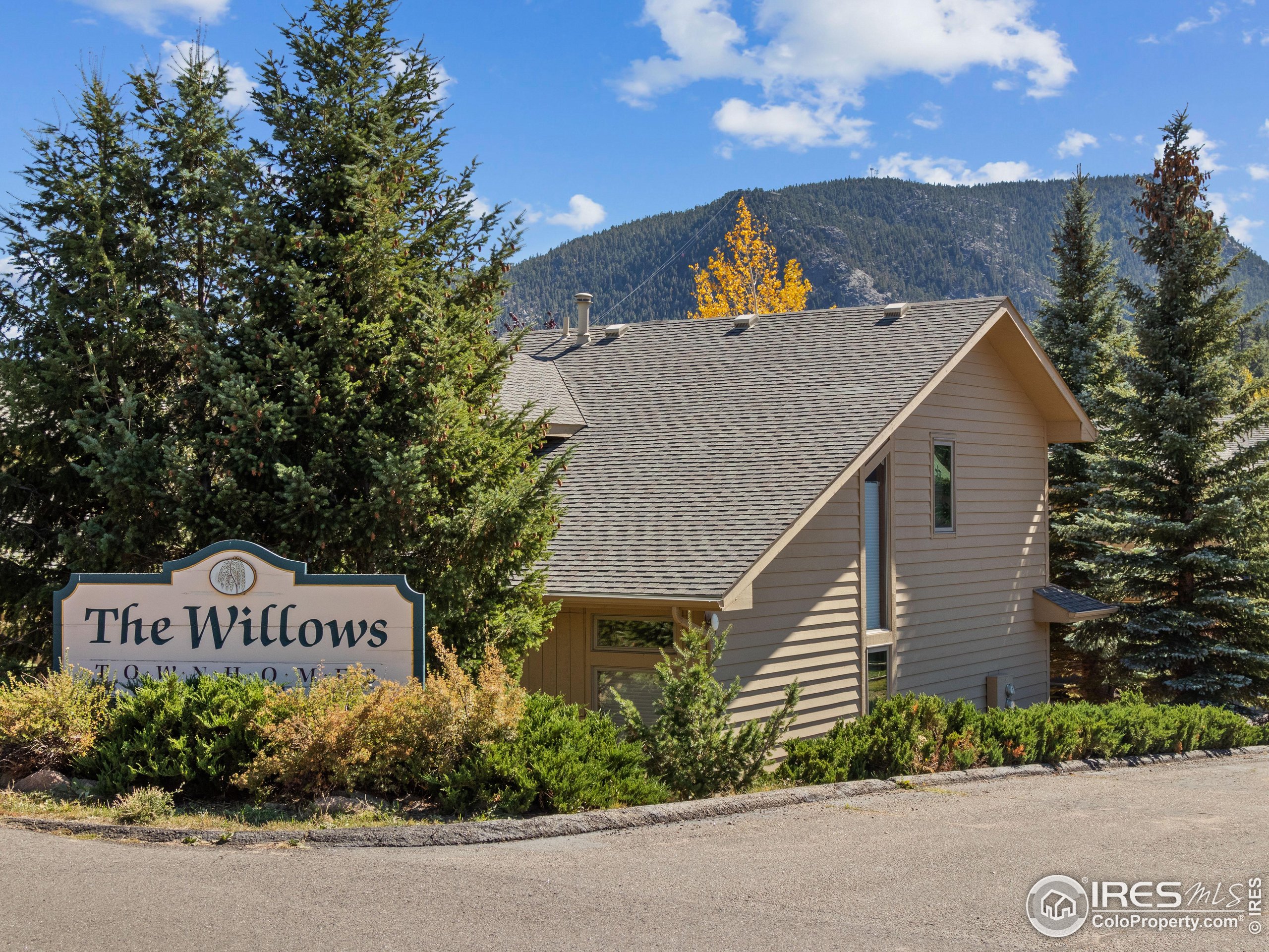 300 Far View Drive, Unit 7 Estes Park, CO 80517 - Photo 26 of 26 a view of a house with a yard and tree s