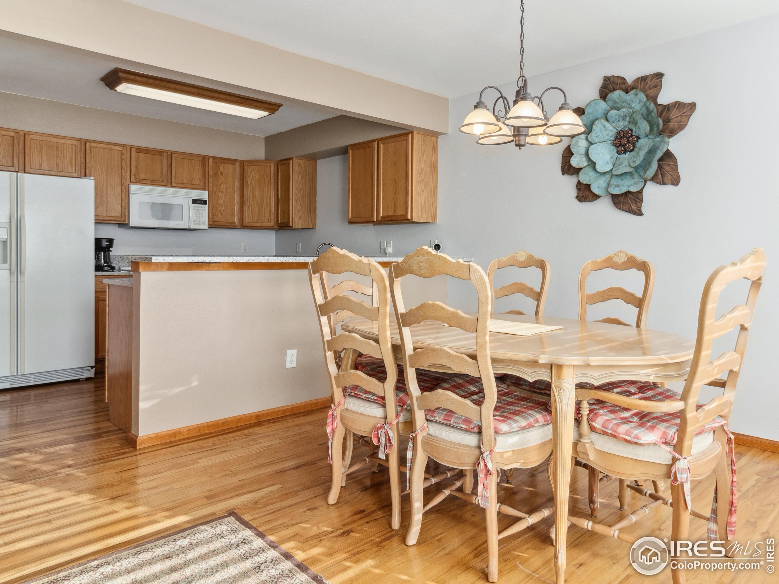 300 Far View Drive, Unit 7 Estes Park, CO 80517 - Photo 6 of 26 a view of a dining room with furniture and wooden floor