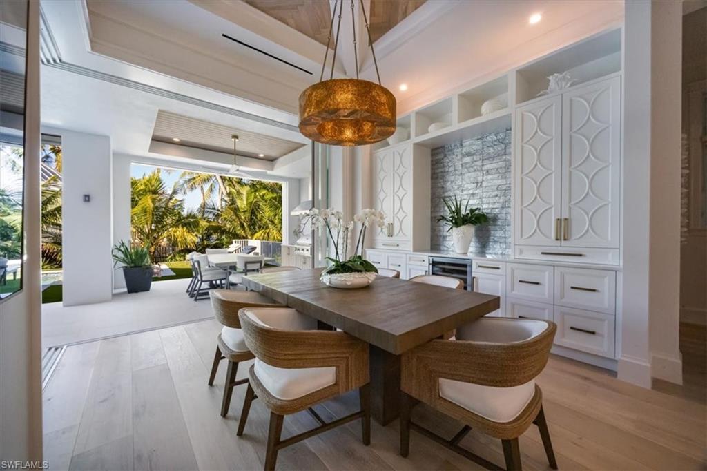 493 8th Avenue South Naples, FL 34102 - Photo 11 of 40 a view of a dining room with furniture window and outside view