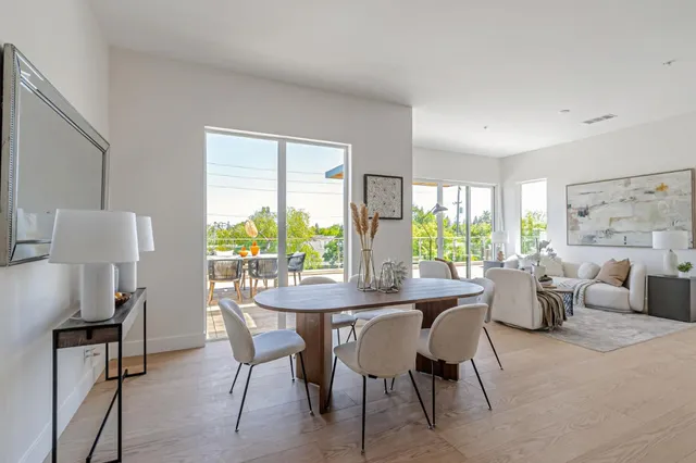 a dining room with furniture and window