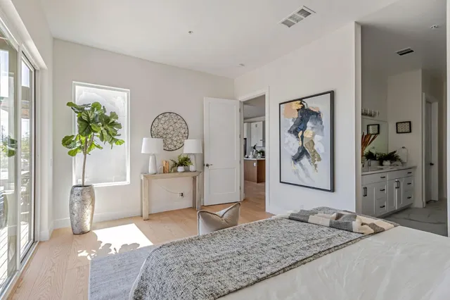 a living room with furniture and a dresser