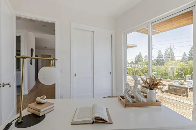 a room with gym equipment and a large window