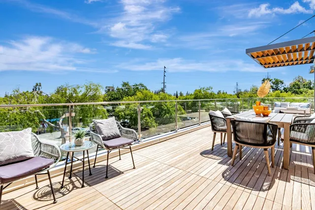a view of a chairs and table on the terrace