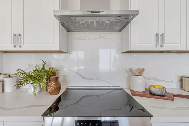 a kitchen with a sink and a stove