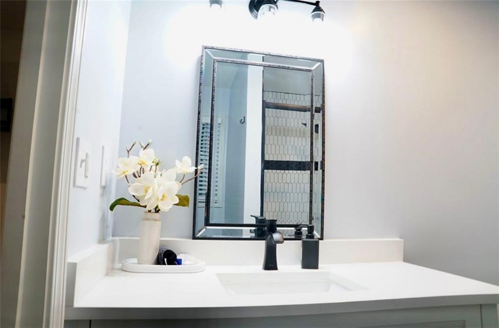 3812 Clovis Court Northwest Atlanta, GA 30331 - Photo 13 of 20 a bathroom with a sink and a mirror