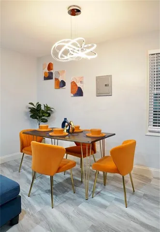 a bedroom with a bed and a flat tv screen