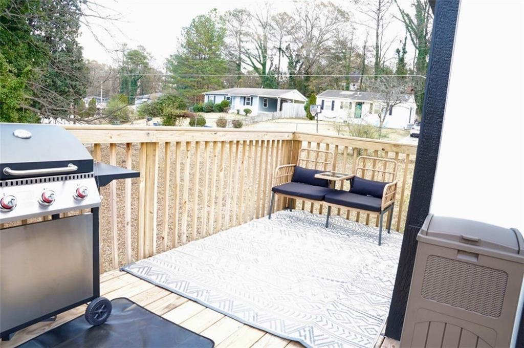 3812 Clovis Court Northwest Atlanta, GA 30331 - Photo 20 of 20 a balcony with a bench and white walls