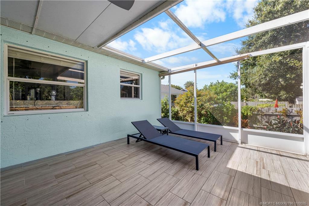 3785 Southeast Middle Street Stuart, FL 34997 - Photo 19 of 31 a outdoor living space with furniture and a potted plant
