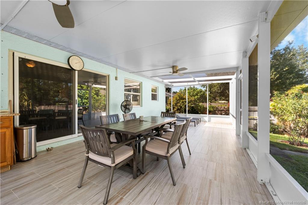 3785 Southeast Middle Street Stuart, FL 34997 - Photo 23 of 31 a view of a dining room with furniture window and wooden floor