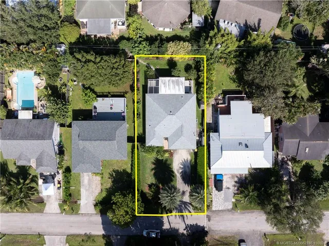 an aerial view of multiple houses with outdoor space
