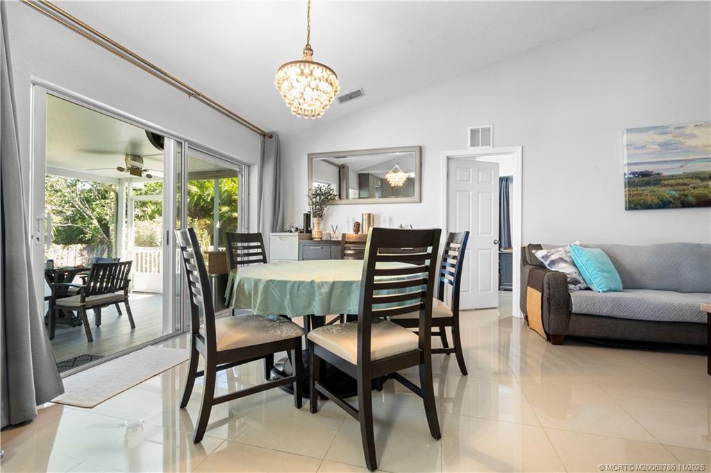 3785 Southeast Middle Street Stuart, FL 34997 - Photo 4 of 31 a view of a dining room with furniture window and outside view