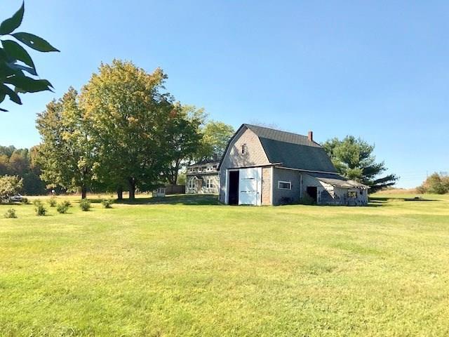 369 Benton Road Albion, ME 04910 - Photo 22 of 30 Looking across the field to the barn...