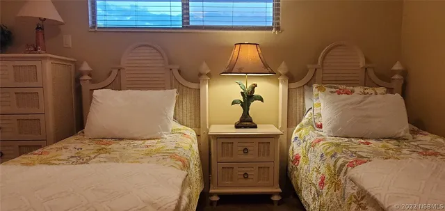 a bedroom with a bed and cabinets