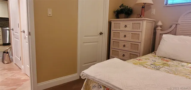 a bathroom with a granite countertop toilet and a sink