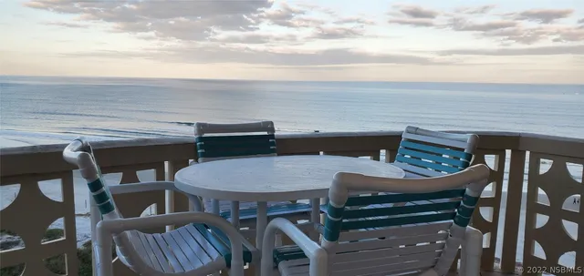 a terrace of a house with outdoor seating