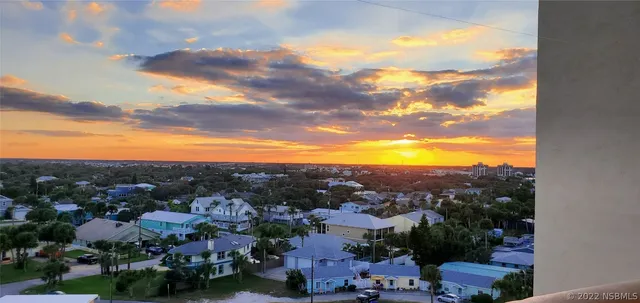 a view of a city with mountains in the background