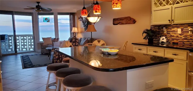 a kitchen with a sink and a refrigerator