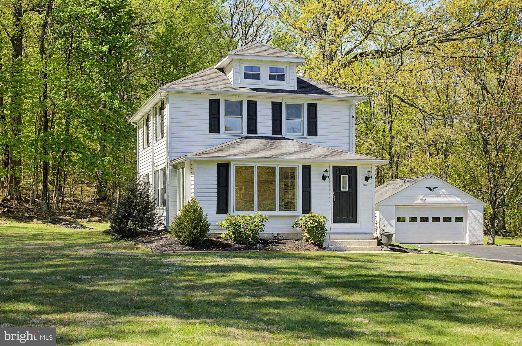 Charming home nestled in lush greenery.
