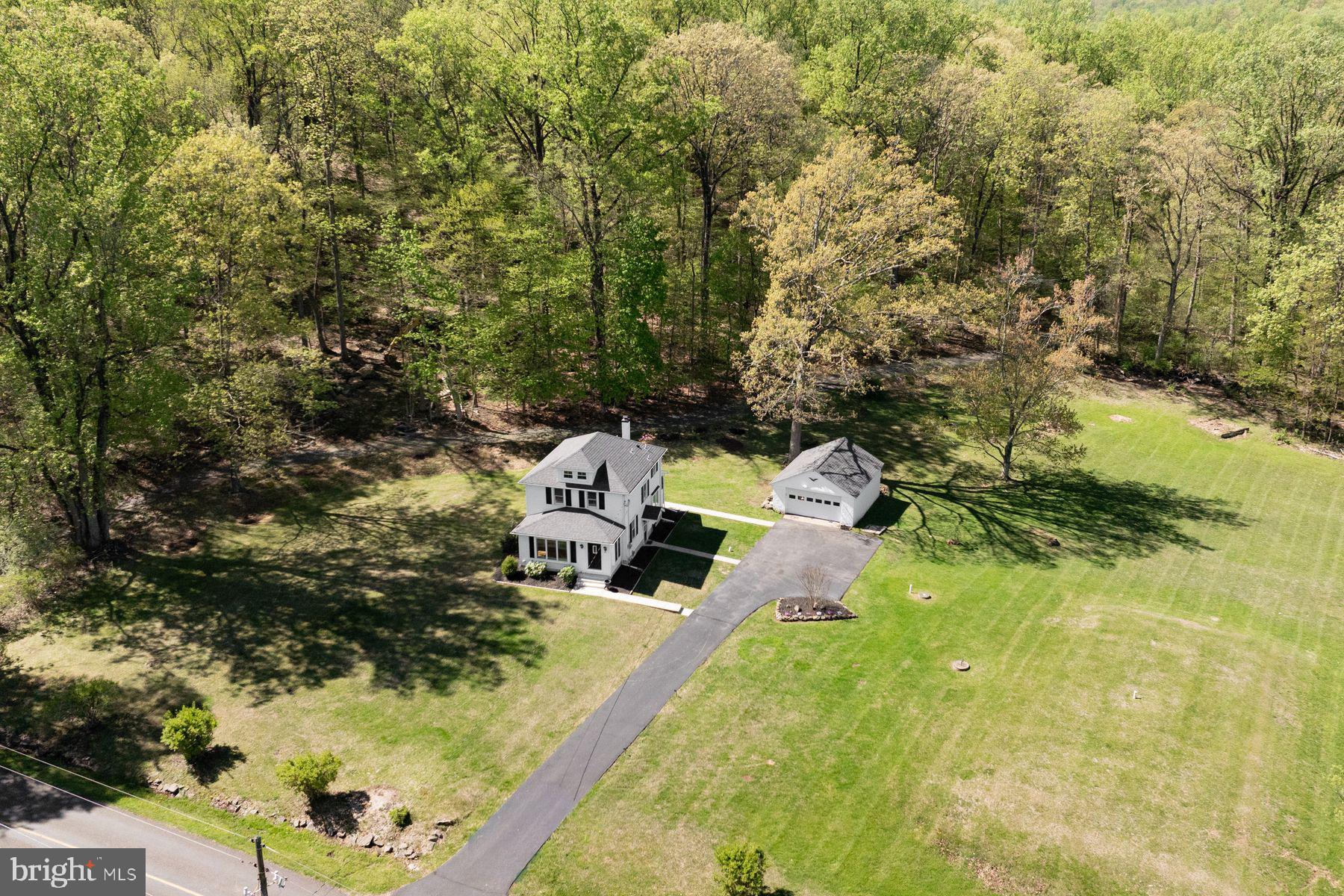 1856 Ringing Rocks Road Upper Black Eddy, PA 18972 - Photo 3 of 49 Serene home nestled in lush greenery.